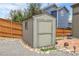 Backyard storage shed near a wooden privacy fence on a property with landscaping at 10540 Tracewood Cir, Highlands Ranch, CO 80130