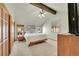 Spacious bedroom with vaulted ceilings, a ceiling fan, large windows, and ample closet space at 4901 W 103Rd Cir, Westminster, CO 80031