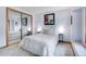 Cozy bedroom featuring soft lighting, a mirror closet, and neutral decor for a tranquil retreat at 4901 W 103Rd Cir, Westminster, CO 80031