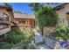 Inviting front entrance with beautiful landscaping, a brick walkway, and charming flower boxes, creating a warm welcome at 4901 W 103Rd Cir, Westminster, CO 80031