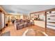Inviting living room featuring an open floor plan and hardwood floors, seamlessly connected to the kitchen and dining areas at 4901 W 103Rd Cir, Westminster, CO 80031