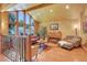 Bright and open living room with a vaulted ceiling, large windows, hardwood floors, and comfortable furnishings at 4901 W 103Rd Cir, Westminster, CO 80031