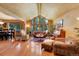 Spacious living room featuring hardwood floors, a vaulted ceiling, and large windows that bring in plenty of natural light at 4901 W 103Rd Cir, Westminster, CO 80031