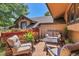Inviting outdoor patio featuring comfortable seating, a decorative fountain, and a colorful flower display at 4901 W 103Rd Cir, Westminster, CO 80031