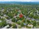 Aerial view of a neighborhood with tree-lined streets and mountain views, near parks and community amenities at 6283 S Prescott St, Littleton, CO 80120