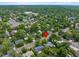 Aerial view of a neighborhood with lush trees, pinpointing a home close to local community buildings at 6283 S Prescott St, Littleton, CO 80120