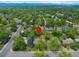 Aerial view showcasing the property's setting with lush greenery and surrounding neighborhood at 6283 S Prescott St, Littleton, CO 80120