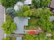 Aerial shot of a property showcasing its layout, landscaping, and vibrant green lawn at 6283 S Prescott St, Littleton, CO 80120