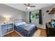 Comfortable bedroom with a ceiling fan, a window, and décor that inspires imagination and relaxation at 6283 S Prescott St, Littleton, CO 80120