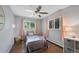 Comfortable bedroom with two windows and neutral décor, ideal for relaxation and rest at 6283 S Prescott St, Littleton, CO 80120