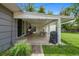 Cozy covered patio with string lights and access to lush backyard and a grill at 6283 S Prescott St, Littleton, CO 80120