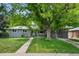 Charming single story home with a large shade tree and welcoming front yard at 6283 S Prescott St, Littleton, CO 80120