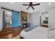 Cozy main bedroom featuring a decorative fireplace and a stylish barn door for a touch of rustic charm at 6283 S Prescott St, Littleton, CO 80120