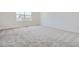 Clean, carpeted bedroom with window to provide natural light at 683 N Deer Park St, Watkins, CO 80137