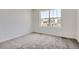 Clean, carpeted bedroom with window to provide natural light at 683 N Deer Park St, Watkins, CO 80137