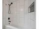 Beautiful bathroom features white subway tiles and black fixtures at 1623 E 164Th Pl, Brighton, CO 80602