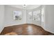 Bedroom featuring hardwood flooring, natural lighting, and neutral-colored walls at 1623 E 164Th Pl, Brighton, CO 80602