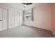 Bright bedroom features neutral carpet, a ceiling fan and closet with sliding doors at 1623 E 164Th Pl, Brighton, CO 80602