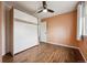 Bedroom with wood floors features built-in cabinets, and a ceiling fan at 1623 E 164Th Pl, Brighton, CO 80602