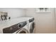 In-unit laundry room featuring modern washer and dryer units at 1623 E 164Th Pl, Brighton, CO 80602