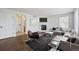 Bright living room featuring a fireplace, wood floors, and modern furnishings at 1623 E 164Th Pl, Brighton, CO 80602