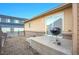 Backyard featuring a small concrete patio, perfect for outdoor grilling, with privacy fence at 23317 E Saratoga Cir, Aurora, CO 80016
