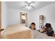 Bedroom with neutral walls, carpet and a ceiling fan, with one window and closet at 23317 E Saratoga Cir, Aurora, CO 80016