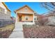 Charming home with a cozy front porch and well-manicured landscaping. Includes steps at 23317 E Saratoga Cir, Aurora, CO 80016