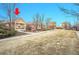 Charming single-story home with a well-maintained front yard and mature trees at 23317 E Saratoga Cir, Aurora, CO 80016
