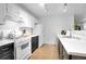 Functional kitchen with white cabinetry and a full suite of appliances at 23317 E Saratoga Cir, Aurora, CO 80016