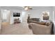 Inviting living room featuring plush seating, carpet, and a ceiling fan at 23317 E Saratoga Cir, Aurora, CO 80016