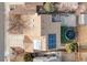 Aerial view of house with solar panels, a wooden deck, trampoline, and artificial turf at 4334 Lisbon St, Denver, CO 80249