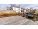 Wooden back deck with wooden railing overlooking backyard with a trampoline at 4334 Lisbon St, Denver, CO 80249