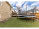 Artificial grass in backyard, featuring a trampoline with safety net at 4334 Lisbon St, Denver, CO 80249