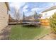 Artificial grass in backyard, featuring a trampoline with safety net at 4334 Lisbon St, Denver, CO 80249