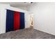 Bright bedroom with neutral carpet and an adjacent bathroom at 4334 Lisbon St, Denver, CO 80249