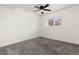 Bright bedroom with a ceiling fan, window, and neutral carpet at 4334 Lisbon St, Denver, CO 80249