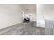 Dining room with dining table, neutral walls, plush carpeting, natural light, and open floor plan at 4334 Lisbon St, Denver, CO 80249