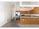 Beautiful kitchen features stainless steel appliances and breakfast bar with stylish countertops at 4334 Lisbon St, Denver, CO 80249