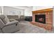 Cozy living room featuring a fireplace and comfortable seating at 4334 Lisbon St, Denver, CO 80249