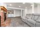 Spacious living room featuring a fireplace and washer dryer at 4334 Lisbon St, Denver, CO 80249