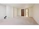Large bedroom with neutral carpet and access to a private bathroom at 14231 E Dickinson Dr # E, Aurora, CO 80014