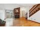 Bright living room featuring a brick fireplace, sliding glass doors, and wood staircase at 14231 E Dickinson Dr # E, Aurora, CO 80014
