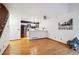 Open-concept living area with hardwood floors connecting to a modern kitchen at 14231 E Dickinson Dr # E, Aurora, CO 80014