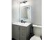 Contemporary bathroom with gray vanity and LED mirror at 2683 S Carson Way, Aurora, CO 80014