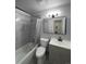 Updated bathroom with a bathtub, shower, and modern vanity at 2683 S Carson Way, Aurora, CO 80014