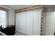 Bedroom with large closet and wood-look accent wall at 2683 S Carson Way, Aurora, CO 80014