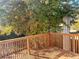 Spacious deck overlooking a wooded backyard with colorful autumn leaves at 2683 S Carson Way, Aurora, CO 80014