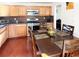 Spacious kitchen with dark wood cabinets and granite countertops at 2683 S Carson Way, Aurora, CO 80014