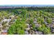 High angle of tree-lined residential streets with glimpses of houses and the city skyline in the background at 536 N Williams St, Denver, CO 80218